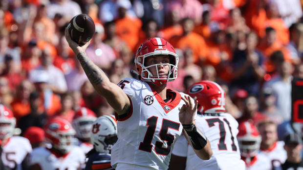 Sep 30, 2023; Auburn, Alabama, USA; Georgia Bulldogs quarterback Carson Beck (15) throws a pass against the Auburn Tigers during the first quarter at Jordan-Hare Stadium.